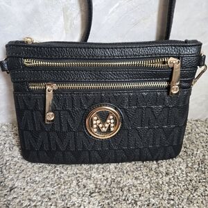 Elegant Black Crossbody Bag with Gold Accents